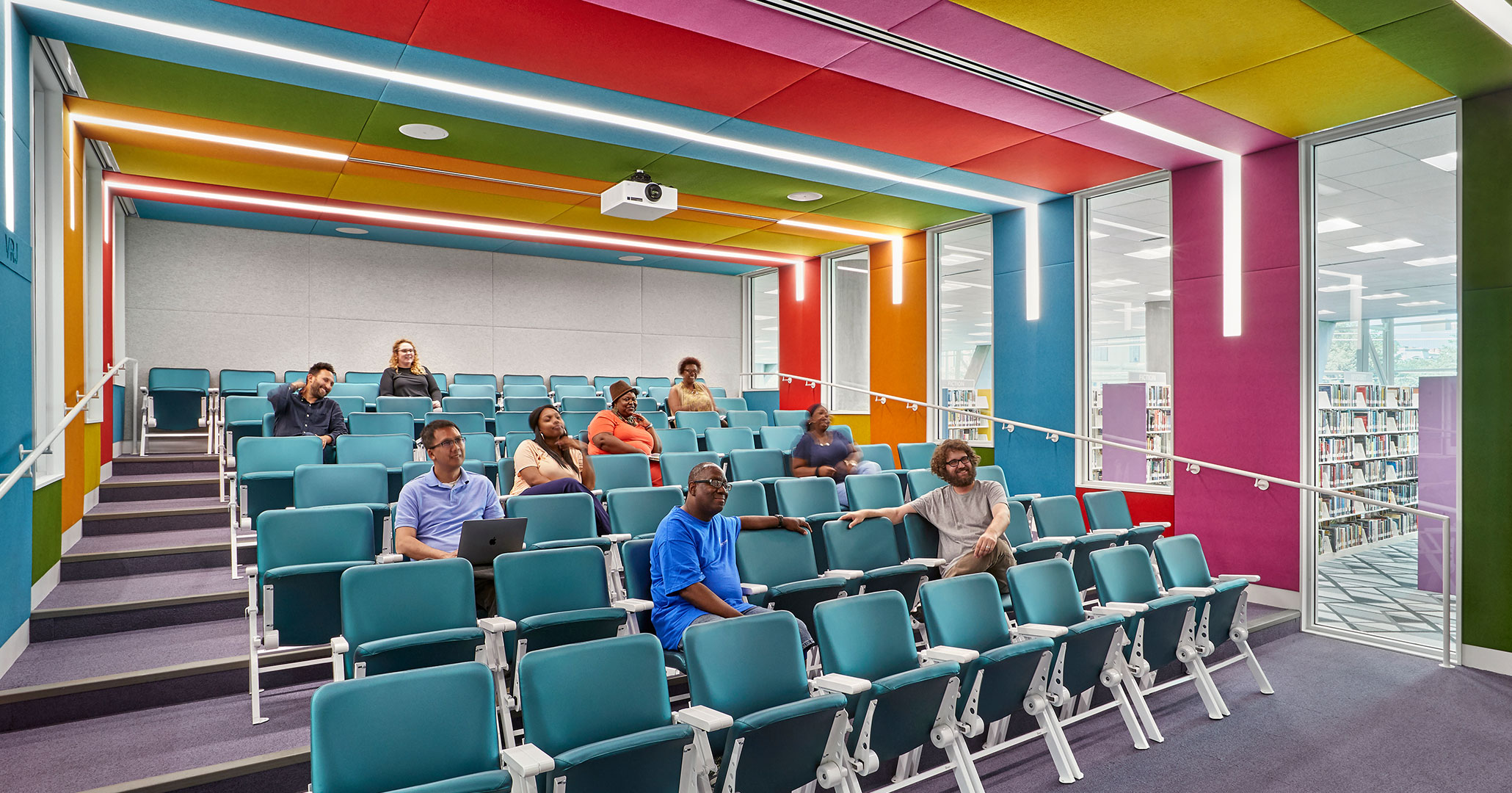 Richland County Library worked with Boudreaux architects to design colorful stadium seating theater for Richland Libraries.