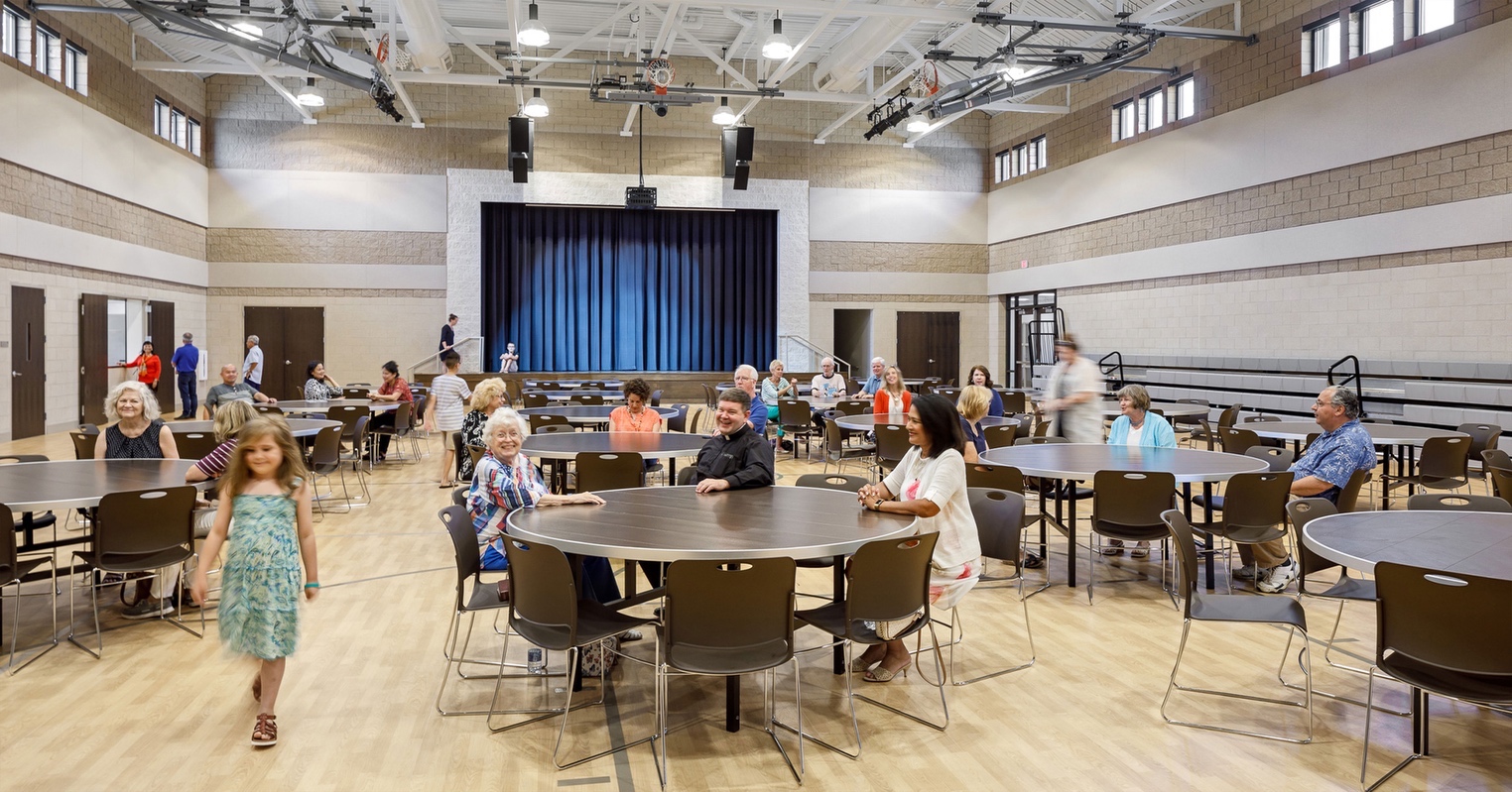 St Mary Magdalene Catholic Church in Simpsonville, SC’s new Parish Life Building has a gymnasium that is a flexible space for congregation, parties, vbs, and events