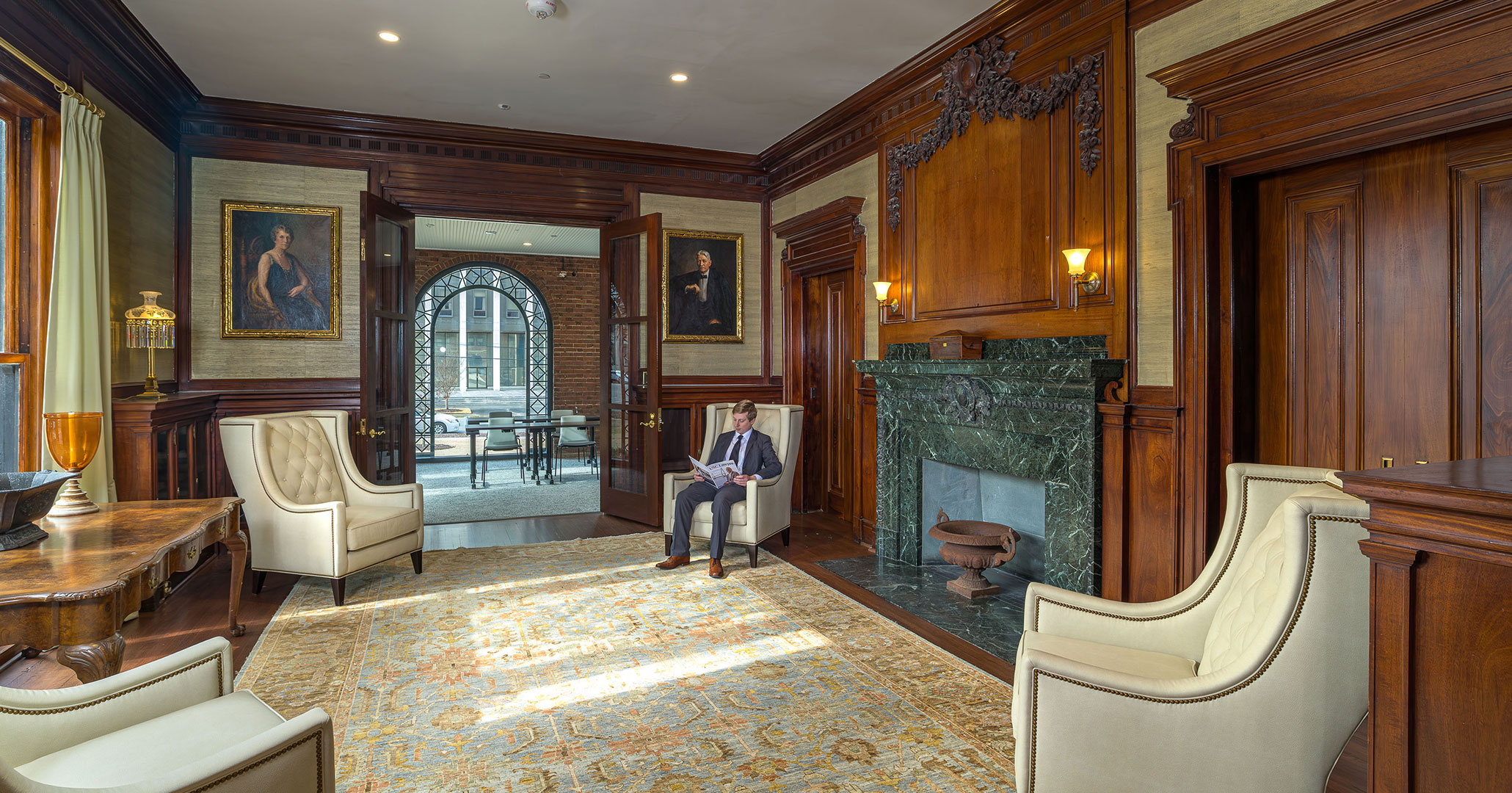 BOUDREAUX architects rehabilitated the wood paneling and fireplace in the library at University of South Carolina's Taylor House