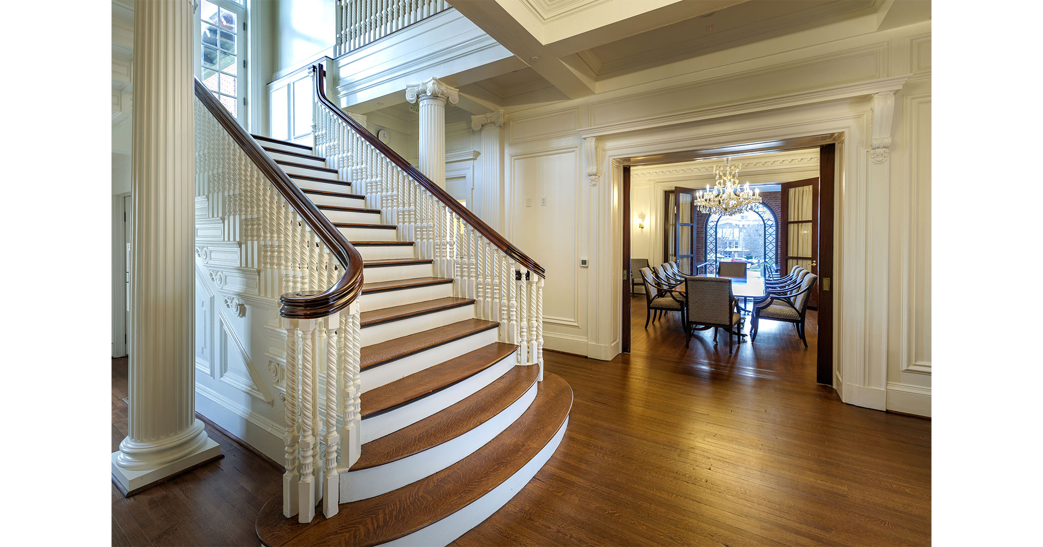 BOUDREAUX architects brought light back into USC's Taylor House by opening balcony windows at the landing of the grand stair