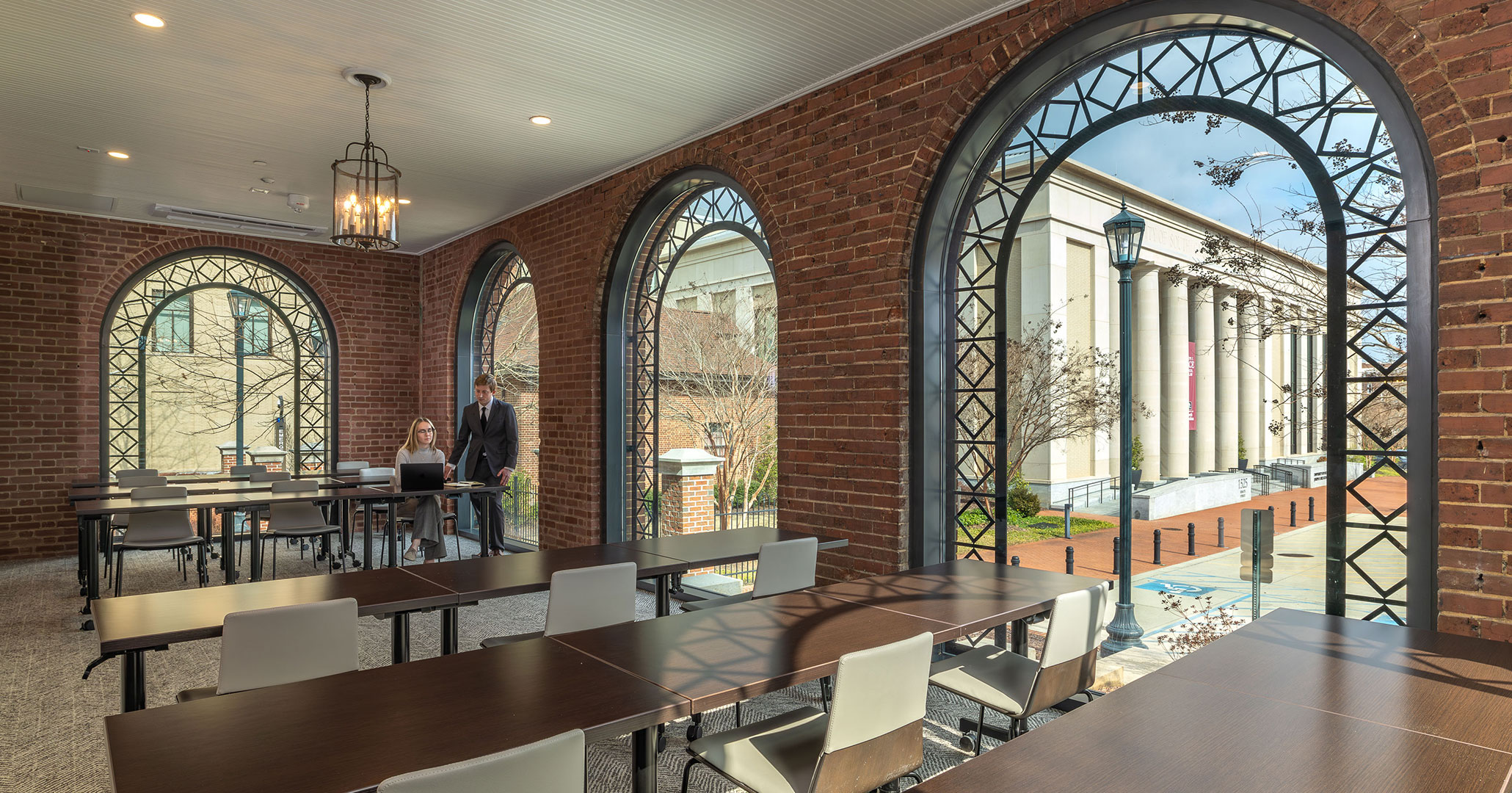 BOUDREAUX architects transformed the previously closed-in porches into light-filled classrooms and meeting spaces